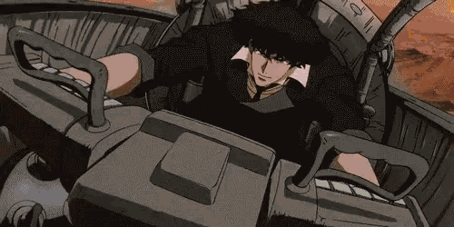 a man is sitting in the driver 's seat of a cowboy bebop vehicle .