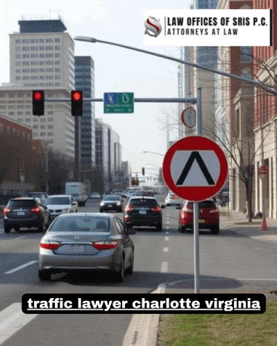 a car is driving down a street with a sign that says traffic lawyer charlotte virginia on the bottom
