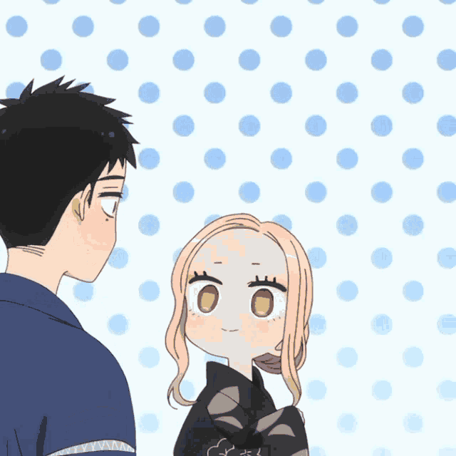 a man and a girl are standing next to each other with a polka dot background