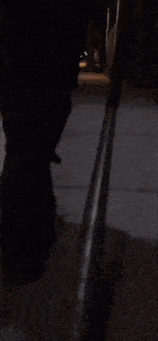 a woman with blood on her face is holding a sword
