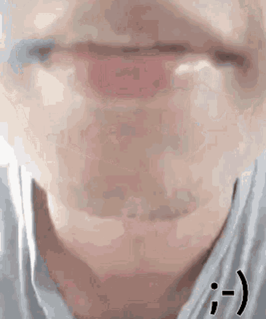 a close up of a man 's mouth with a smiley face .