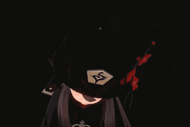 a girl wearing a black hat with a letter e on it
