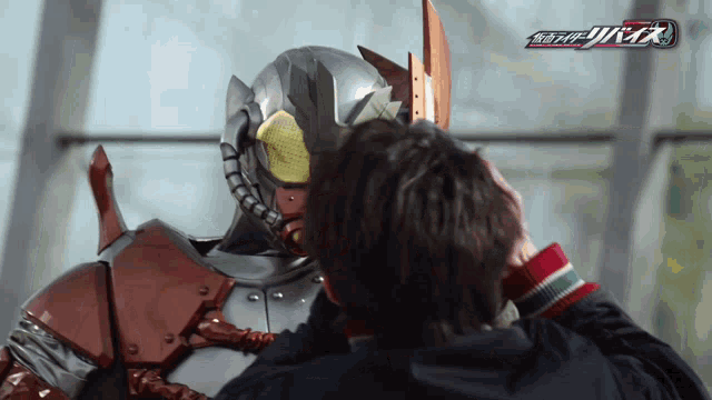a man wearing a helmet with the word kamen rider on the top