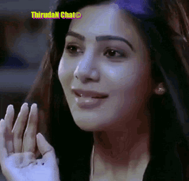 a close up of a woman 's face with thiruden chat written on the bottom right