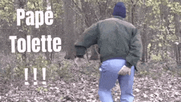 a man in a jacket is walking through the woods with a bottle of toilette in his pocket .
