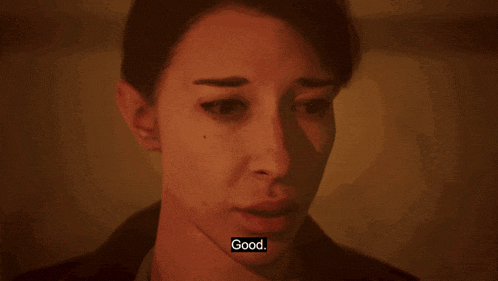 a close up of a woman 's face with a caption that says " good "