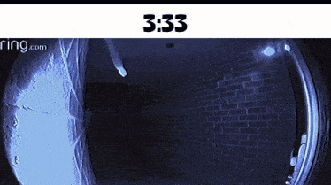 a picture of a brick wall with 3:33 written on it