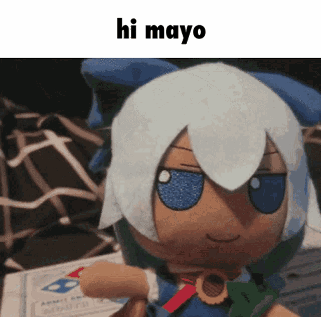 a stuffed doll with white hair and blue eyes is holding a piece of paper that says hi mayo .