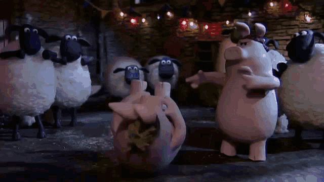 a group of sheep and pigs are standing around a pig holding a heart .
