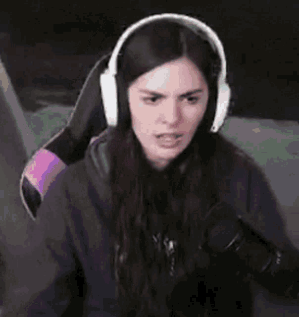 a woman wearing headphones is surrounded by colorful stars