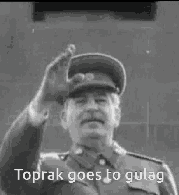 a black and white photo of a man with the words toprak goes to gulag