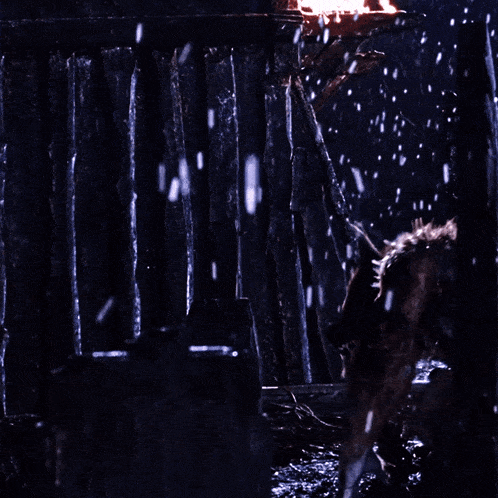 a werewolf with sharp teeth is standing in the rain
