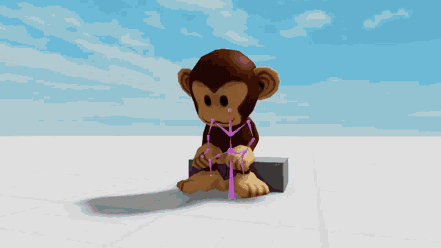 a cartoon monkey is sitting on a block with a pink scarf around his neck