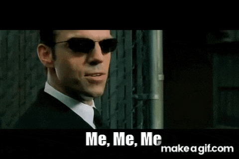 a man in a suit and tie is wearing sunglasses and saying `` me , me , me `` .