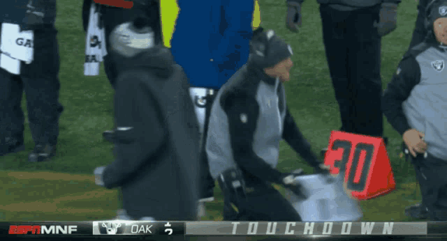 a football game is being played between oak and oakland