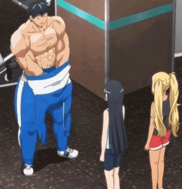 a man with a very muscular body is standing next to two girls