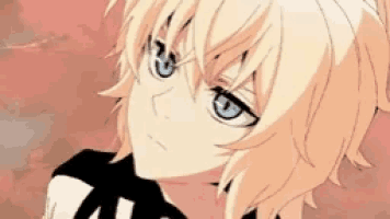 a close up of a person 's face with blue eyes and blonde hair .