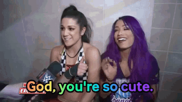 two women with purple hair are sitting next to each other with the words god you 're so cute .