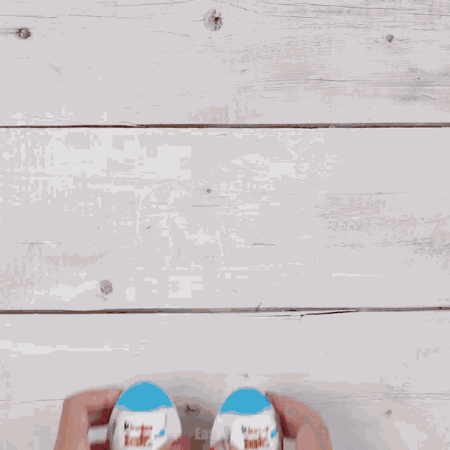 a person is opening a kinder joy candy bar