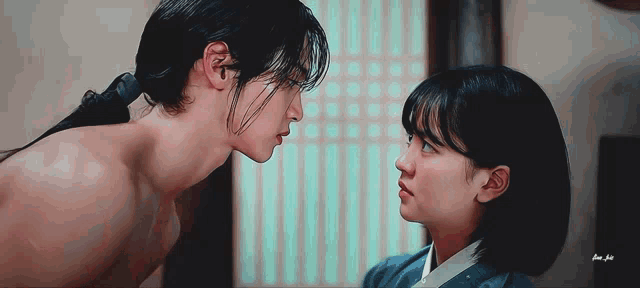 a man and a woman are looking into each other 's eyes ..