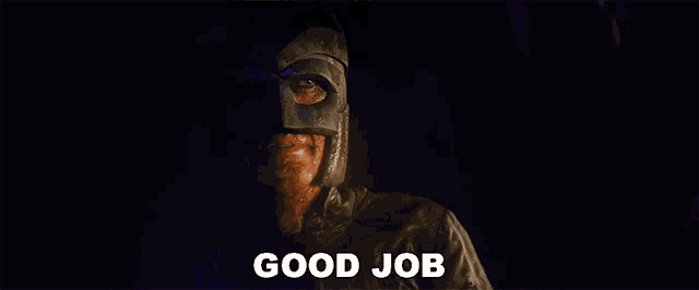 a man in a mask says good job in white letters