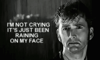a black and white photo of a man with a caption that says i 'm not crying it 's just been raining