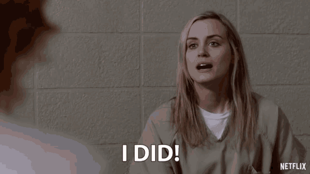a woman in a prison uniform says i did
