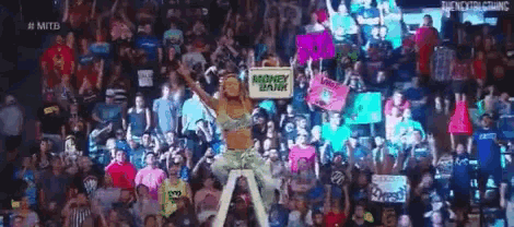 a woman is holding a sign that says money in the bank .