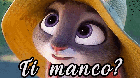 a cartoon rabbit wearing a hat with the words ti manco below it