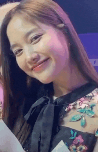 a close up of a woman 's face with the number 1 visible