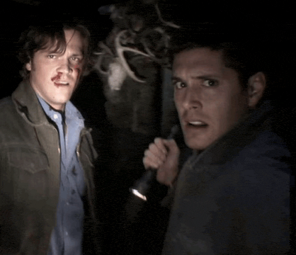 two men are standing next to each other and one has a bloody nose