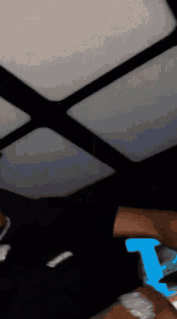 a blurry picture of a person playing a video game on a phone