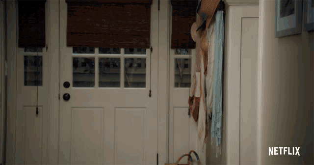 a white door with a netflix logo on the bottom right