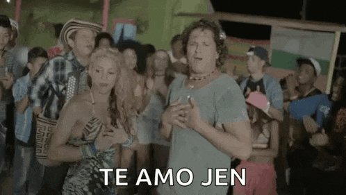 a man and a woman are dancing in front of a crowd with the words `` te amo jen '' written above them .