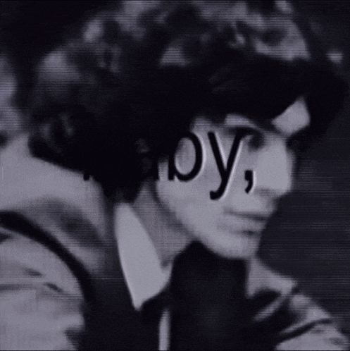 a black and white photo of a man with the words " boy " written on his face ..
