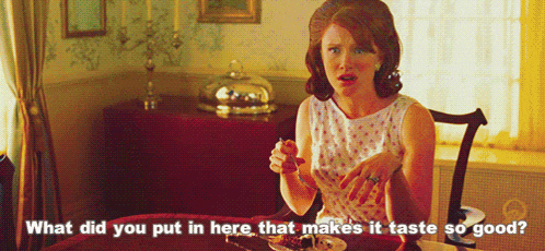 a woman sits at a table with a plate of food and says what did you put in here that makes it taste so good ..