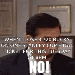 a man in a suit and tie is holding a ticket for a stanley cup final at 8 pm .