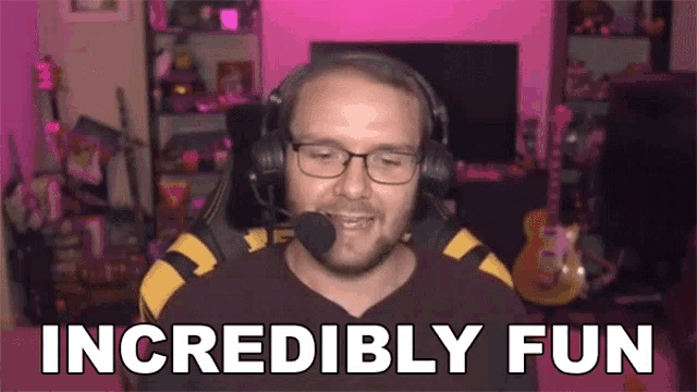 a man wearing headphones and glasses says incredibly fun in front of a pink background .