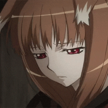 a close up of a girl 's face with red eyes .