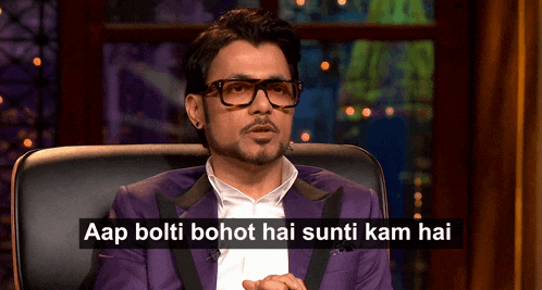 a man wearing glasses and a purple suit says aap bolti bohot hai sunti kam hai in a caption
