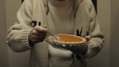 a person wearing a sweater with the letter n on it