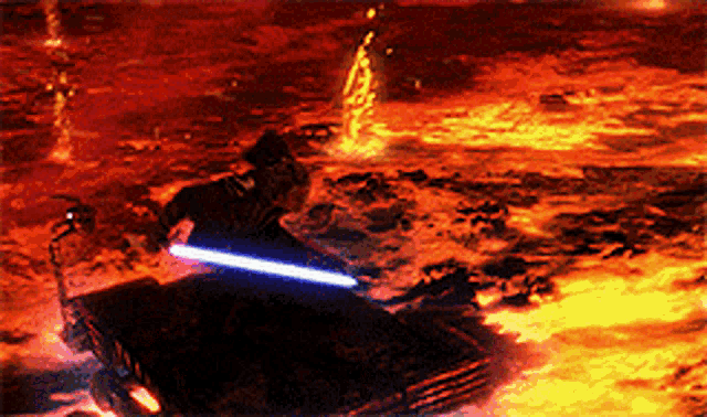 a man is holding a lightsaber while riding a vehicle through lava