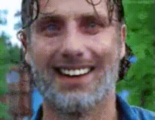 a man with a beard is smiling in a pixelated photo .