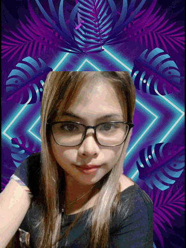 a woman wearing glasses takes a selfie in front of a purple background