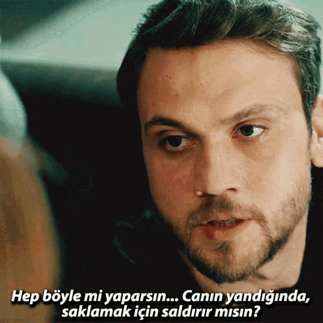 a close up of a man 's face with the caption hep böyle mi yaparsin canin yandiginda