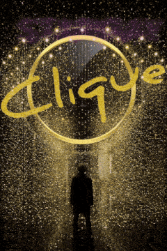 a man stands in front of a clique logo