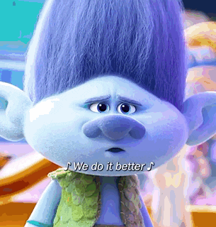 a troll with purple hair and a green vest says " we do it better "