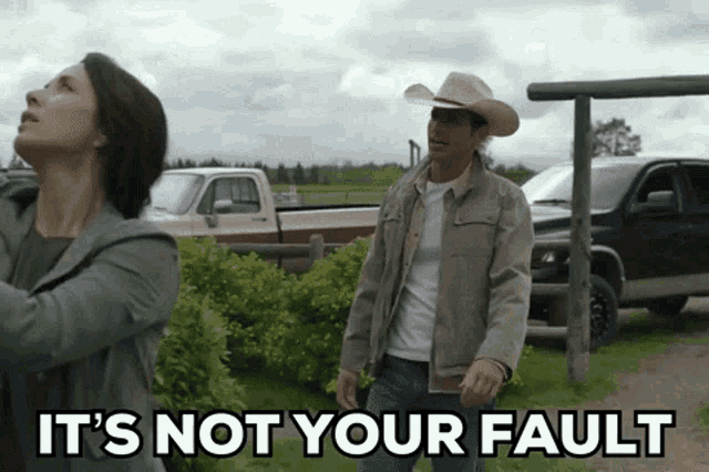 a man in a cowboy hat stands next to a woman with the words it 's not your fault