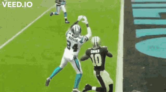 a football player with the number 10 on his jersey jumps over another player