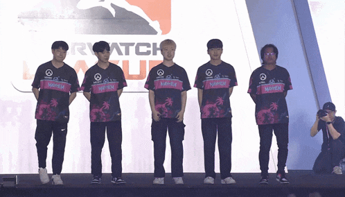 a group of young men are standing in front of a sign that says match
